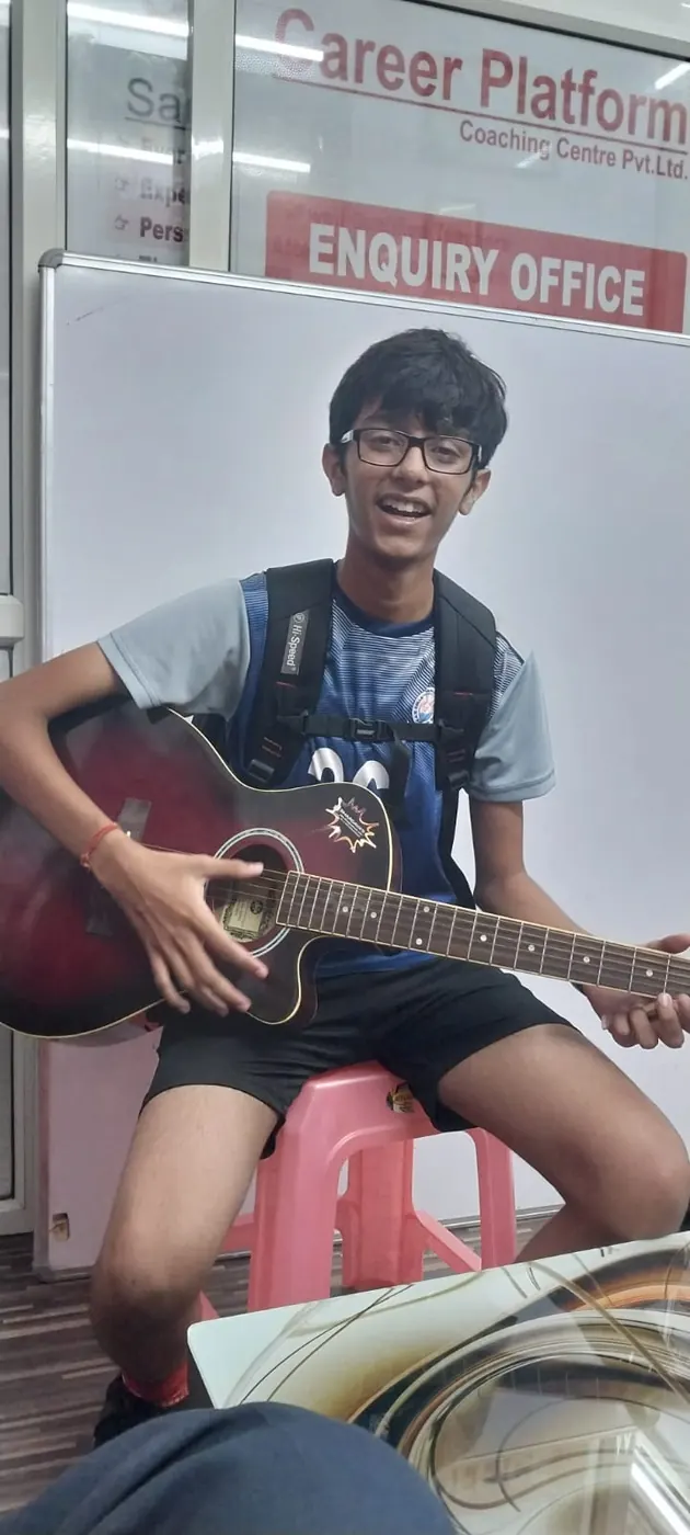 Career Platform student playing the guitar at the centre